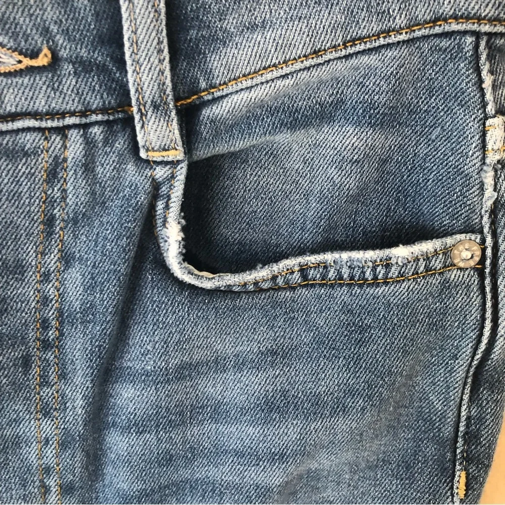 Free people we the free phoenix distressed blown out knees high rise jeans